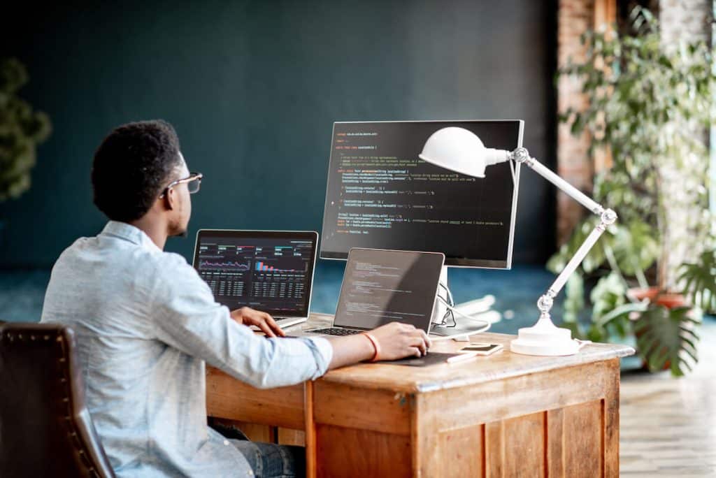 Python finance: programmer using a laptop